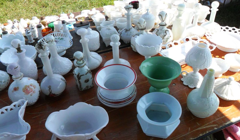 Milk Glass- Selection of collectible antique and vintage Glass (mostly older Victorian-era pieces) at an outdoor flea market near Harrodsburg, Kentucky. 