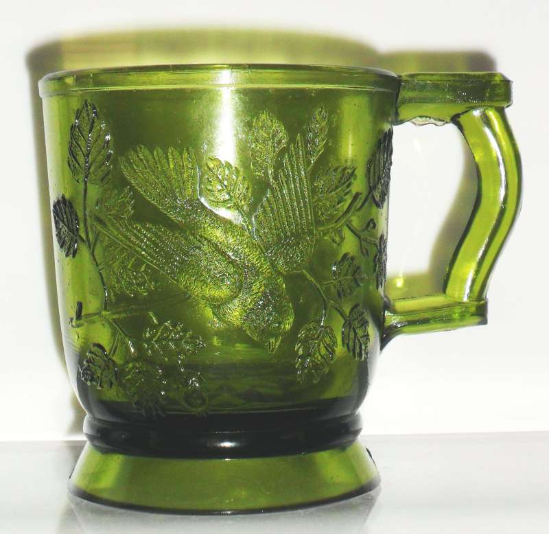 Mosser Glass Company olive green "Robin in a tree" mug, probably 1970s.