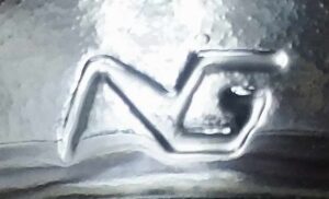 NG connected mark - National Company for Glass and Crystal - Sharkia Egypt - seen on heel of glass packer jar.