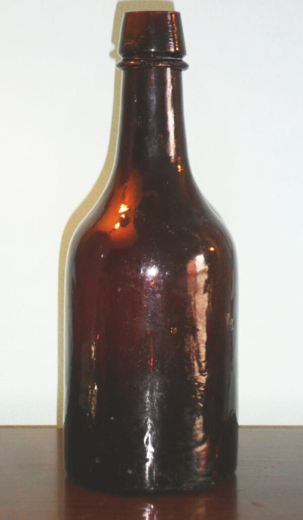 Amber ale bottle made by New Albany Glass Works of New Albany, Indiana in the 1867-1872 time period.