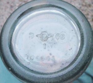 Base of Yacht Club Beverages ACL soda bottle, bearing 1966 date code along with older mark. (Photo courtesy of Taylor McBurney)