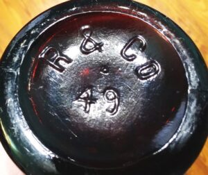 R & CO beer bottle - 49 mold number on base. Bottle made by Reed & Company.