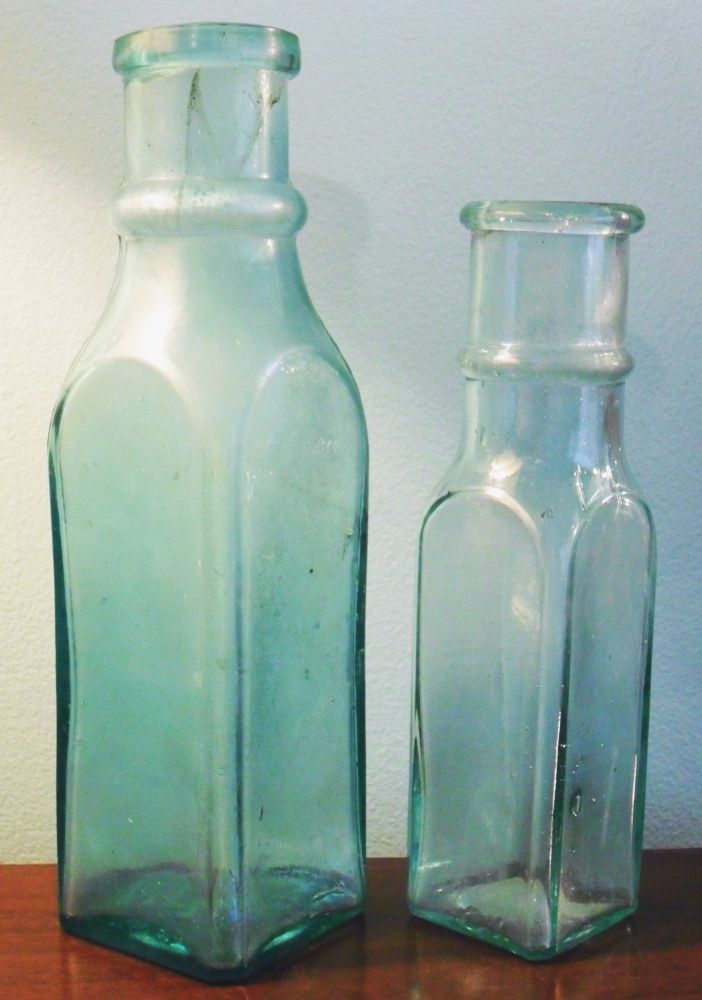 Southern Glass Works, Louisville, KY - Two antique aqua-colored pickle bottles.