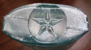 Star on base of aqua strap-side flask - probably made by Star Glass Works of New Albany, Indiana 