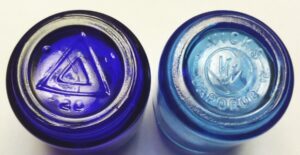 Type 1 base on left, type 2 base on right. Vicks Vaporub jars, small size.