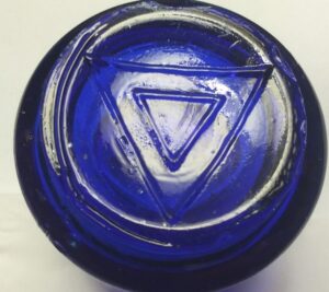 VICKS VAPORUB jars -- Type 1 base - double triangle. This jar bears a larger triangle that extends to the edges of the base. This might be an example of one of the older Base type 1 jars. 