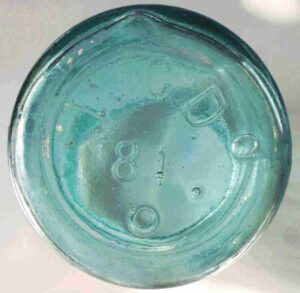 W.C.DePauw Glass Company, New Albany, Indiana jar marked "W.C.D. on base.