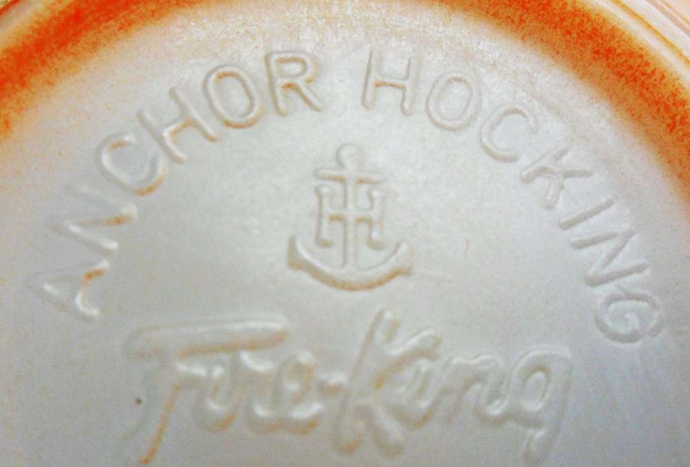 Anchor Hocking Glass Corporation - mark as seen on base of orange Fire-King mug. 