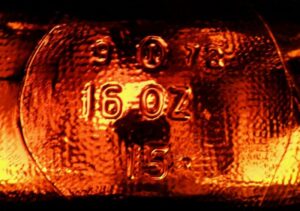 Base markings on rectangular amber bottle made by Owens-Illinois. This bottle was made in 1972 at plant number 9 which was Streator, Illinois. 