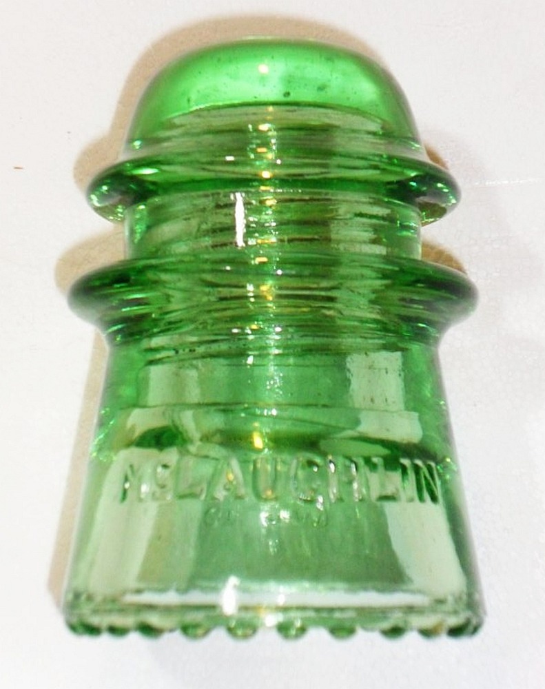 CD 122 McLaughlin-16 "toll" style (long distance) glass insulator in a bright apple or lime green.