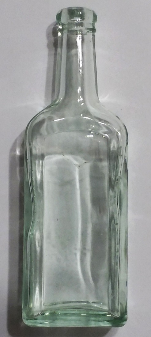 Typical machine-made "Chas. H. Fletcher's / Castoria" bottle in light green.