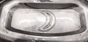 Crescent Moon logo on base of clear glass Druggist / Prescription bottle, used by Crescent Bottle Company.