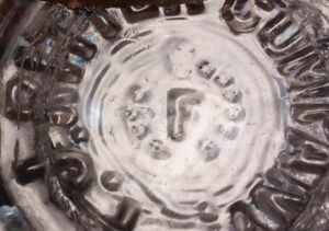 "F with dots" mark on base shard of bottle made for P. J. Ritter Company of Philadelphia.