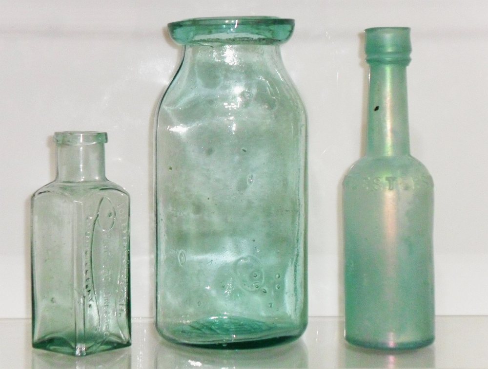 Left to right: JOSEPH GOLDBACH / PORPOISE OIL DRESSING / LOUISVILLE,KY. (shoe/leather dressing); Wax sealer type fruit jar; Worcestershire Sauce bottle, all marked F.C.G.CO. on base.