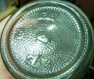 "G A C"  mark used by Arkansas Glass Container Corporation, as seen on packer jar (Photo courtesy of Adrya Webb)