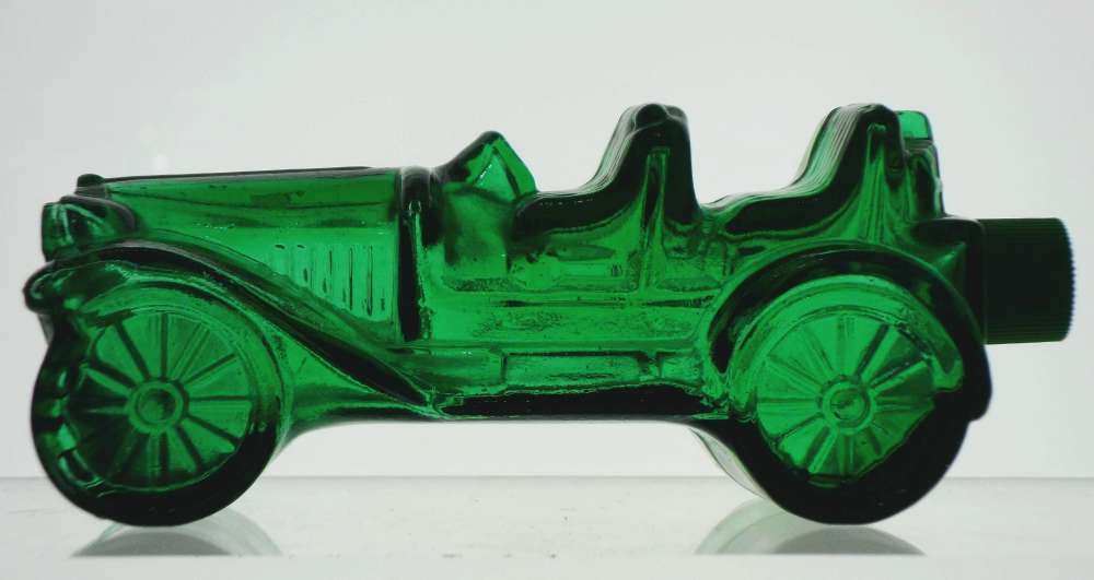 Avon car bottle, emerald green. Contained Tai Winds or Wild Country Aftershave, circa 1973.