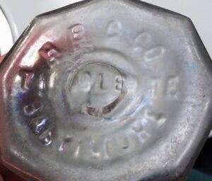 "H B G CO / TALCOLETTE / BALTIMORE" on base of  eight-sided cosmetic jar - Henry B. Gilpin Company, Baltimore, MD