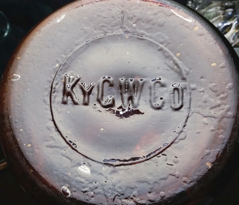 KYGWCo dark amber fruit jar - photo of base markings.