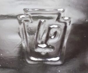 LP in a keystone - mark used by Pennsylvania Bottle Company, Wilcox, Pennsylvania and Sheffield, Pennsylvania (1940-1952) The bottles were distributed by Lummis Glass Company, a distributor based in New York City.