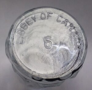 Libbey of Canada mark on base of Waffle Block restaurant-style salt shaker in clear glass. "6" is a mold number.