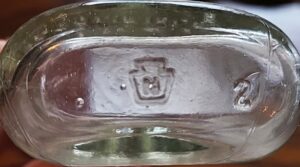 "N in a keystone" mark - Newborn Glass Company, Royersford, PA., as seen on base of oval bottle (photo courtesy beckyreedde@Gmail.com)