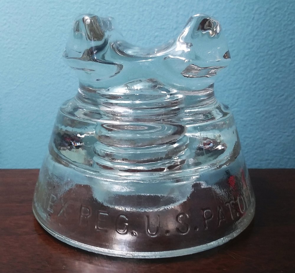 CD 233 clear power line insulator, circa 1930s or 1940s.  Marked "PYREX REG. U.S.PAT.OFF. // 661 / CORNING  MADE IN U.S.A."