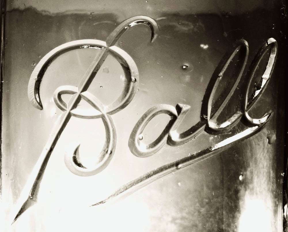 "Ball" cursive mark - embossed trademark as seen on clear glass "Ball Perfect Mason" jar