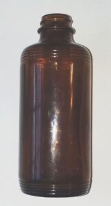 Generic cylindrical Fairmount Glass Company bottle with "F in a hexagon" mark on the base. This might have held some type of cleaner or furniture polish. It measures 6 inches in height.