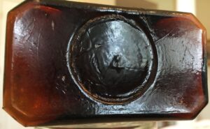 Base of Rawleigh's amber bottle (Photo courtesy ebay seller "704mikem")