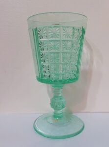 "Two Panel" pattern goblet in Apple Green, made by King, Son & Company of Pittsburgh. This goblet is etched "Henry Davidson" on the front and "Southern Exposition 1885" on the rear panel.