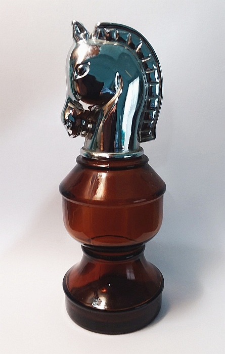 "SMART MOVE" (Knight) chess piece AVON men's cologne decanter - the sticker on base indicates this bottle held Öland Cologne- sold in the Smart Move (Knight) bottle in 1971-1972 (according to info from Bud Hastin).  This was one of six different bottles (also including the King, Queen, Rook, Bishop and Pawn) all part of a Chess piece decanter set sold in the 1971-1976 period.