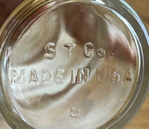 "S T Co / MADE IN USA" on the base of a small clear glass spice jar (Photo courtesy of Stephanie Dougherty)