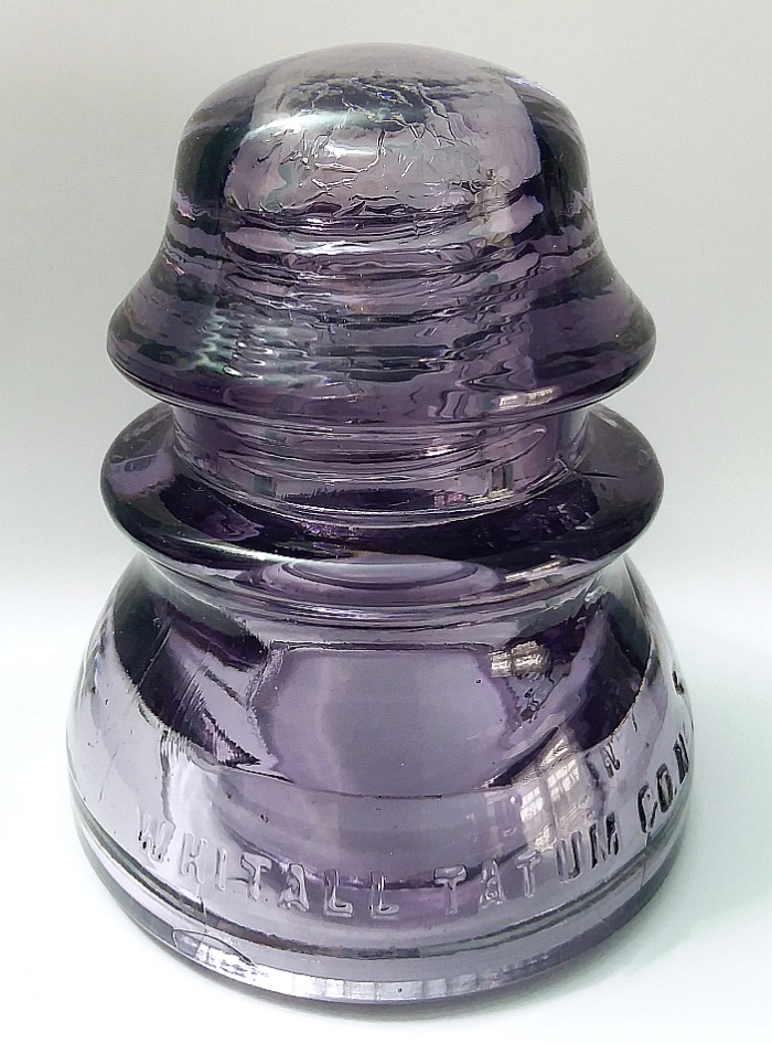 "WHITALL TATUM CO. NO. 1 // MADE IN U.S.A." purple insulator made for  "open wire" telegraph and telephone lines - made by Whitall Tatum Company of Millville, New Jersey.