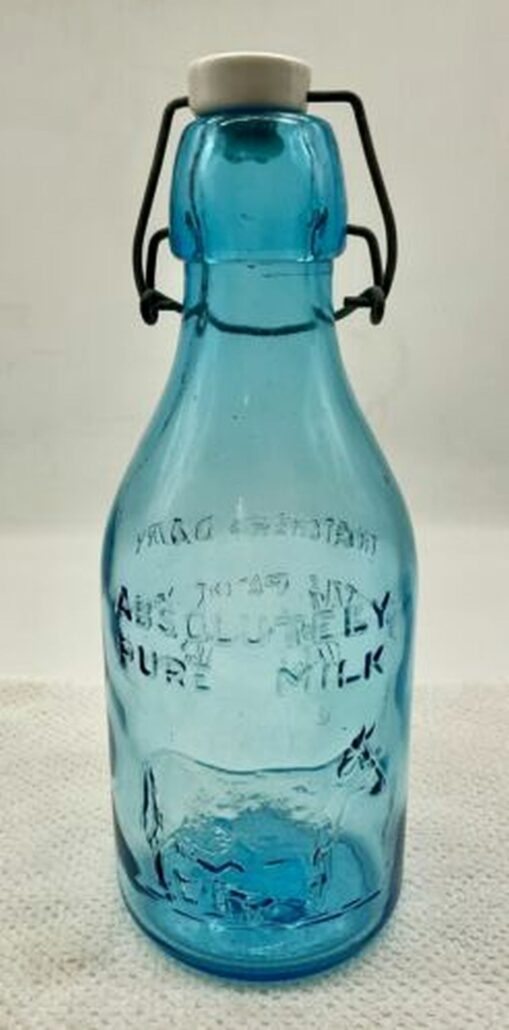 Blue Glass Thatcher's Dairy bottle - Absolutely Pure Milk - Crownford China Co. on the base,  likely made in Italy. (Photo from ebay seller Pammys Collectibles). 