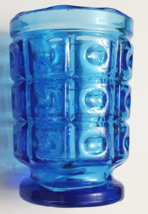 Blue pattern glass footed votive candle holder, uncertain maker.