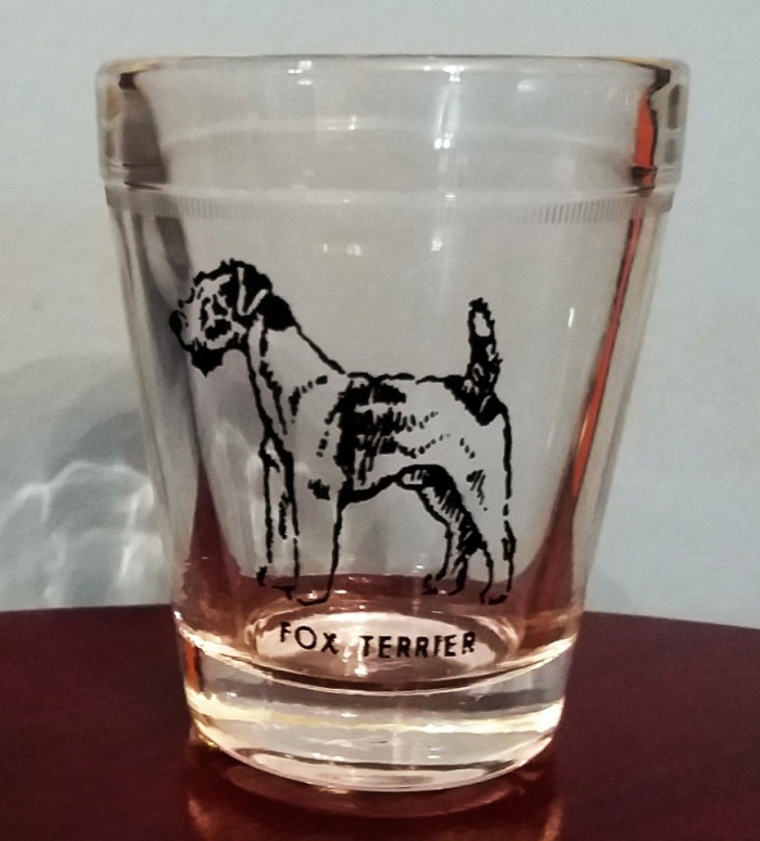 Fox Terrier shot glass made by Hazel Atlas. The base is marked with the  "H over smaller A"  trademark.  This was part of a set.