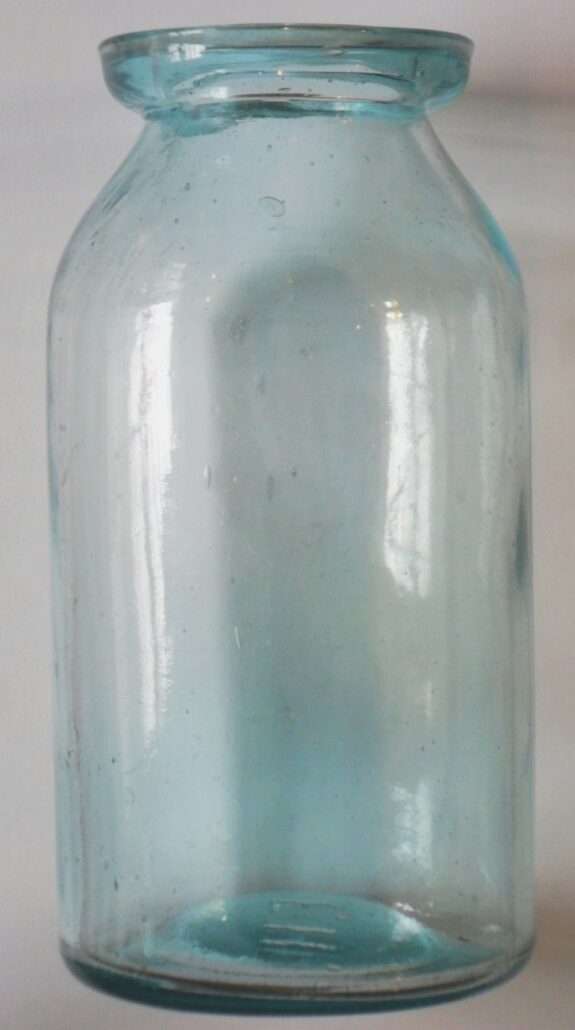 Wax sealer fruit jar, marked with the initials "F. H." on the base. This jar was made by Frederick Heitz Glass Works of St. Louis, MO.