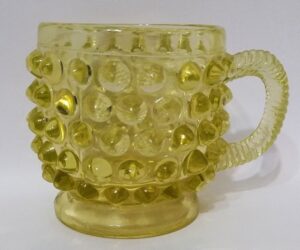 Canary / Vaseline Glass "Hobnail" pattern mug, dating from the 1880s-1890s.