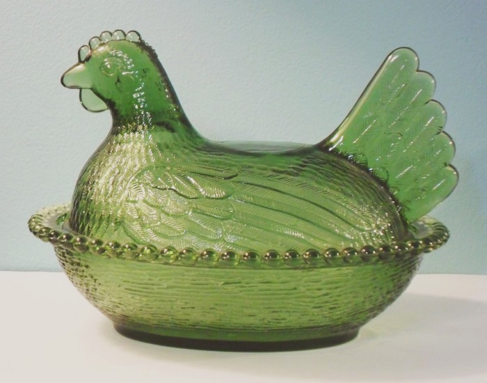 Indiana Glass Company "hen on nest" dish in an avocado green or olive green colored glass.