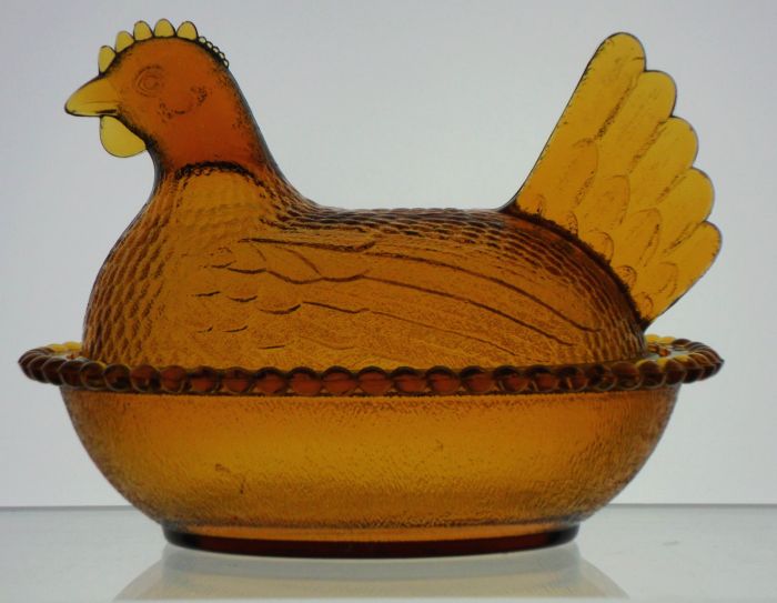 Indiana Glass Company "hen on nest" candy dish in a medium amber glass.