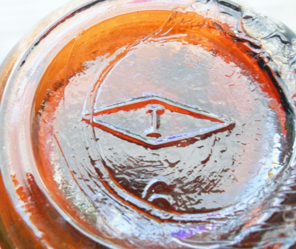 "I inside a diamond" trademark on bottom of small narrow-mouth amber bottle made by Illinois Glass Company.