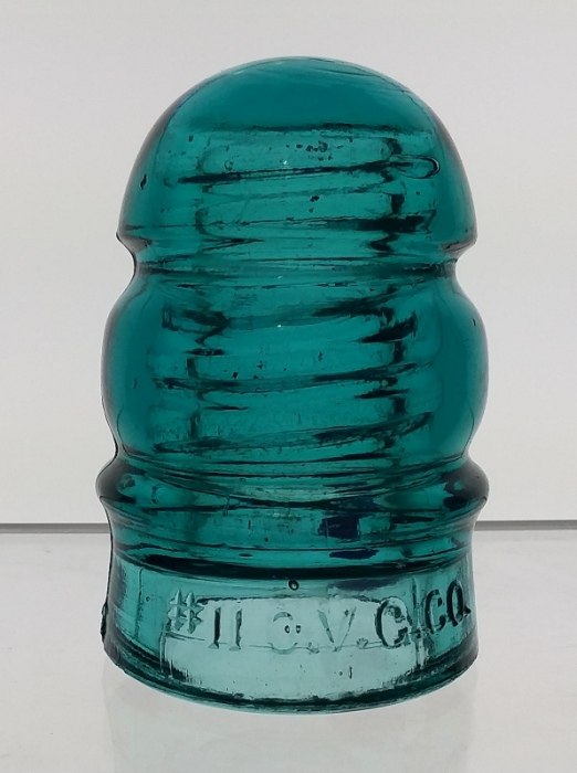 "#11 O. V. G. CO. " marked Blue Aqua "Keg" style glass telephone insulator - CD 112. This was manufactured by Ohio Valley Glass Company of Pleasant City, Ohio. 