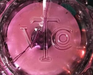 VTCo monogram - Victorian Trading Company, seen on base of candle holder - photo courtesy of Ann Schwoerer. 