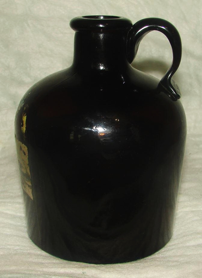 Dark amber jug with applied handle - marked F.C.G.CO. on base (photo courtesy of Kevin C.)