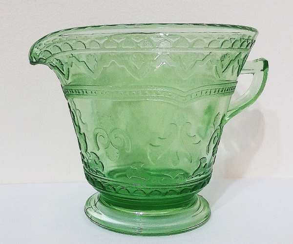 "PATRICIAN" pattern creamer in medium green glass - made by Federal Glass Company during the Depression era. This glows under a black light.