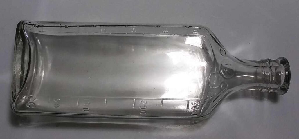 12 ounce clear rectangular LYRIC brand druggist bottle - made by Illinois Glass Company