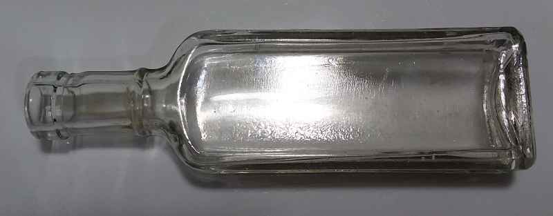 Illinois Glass Company rectangular "ball neck panel" type bottle (base photo above) marked "I in a diamond". This style of bottle was made in about 20 different sizes, and used for a wide variety of products.