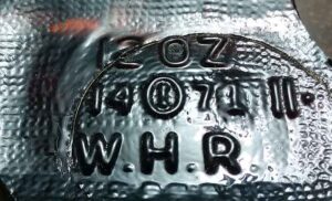 'W. H. R." marking on amber bottle base shard. This was probably the base from a glass MAALOX bottle, made by the William H. Rorer  pharmaceutical company.