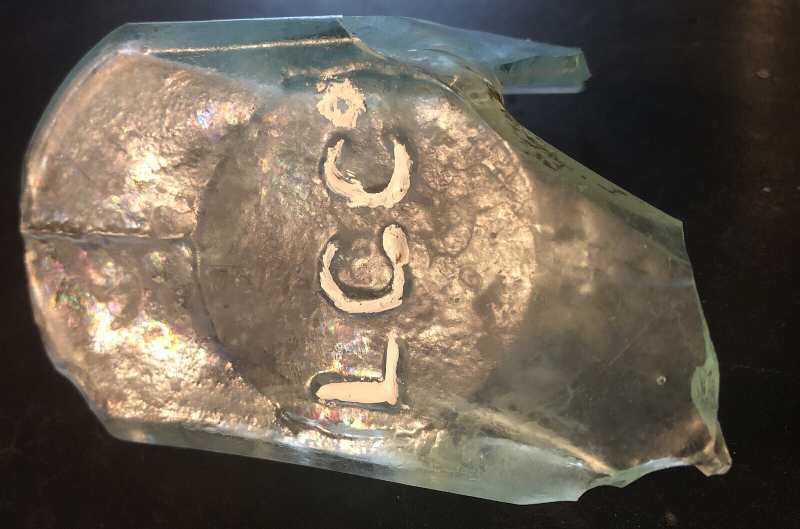 L. G. Co mark on aqua base shard from quart-size hinge-mold flask - unidentified maker but possibly Lindell Glass Company. Found near Buffalo Gap, Texas. (Photo courtesy of "Eryops"). L. G. Co mark on aqua base shard from quart-size hinge-mold flask - unidentified maker but possibly Lindell Glass Company. Found near Buffalo Gap, Texas. (Photo courtesy of "Eryops").