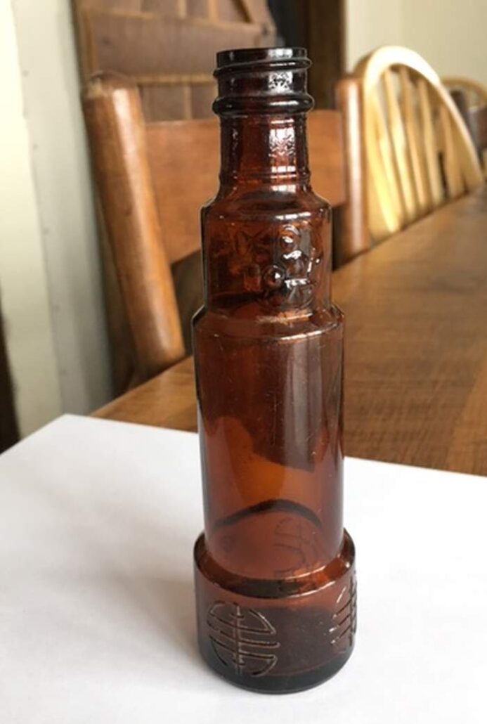 Amber telescope-shaped bottle made by Fairmount Glass Works. (Photo courtesy of Jane Roth). Amber telescope-shaped bottle made by Fairmount Glass Works. (Photo courtesy of Jane Roth).